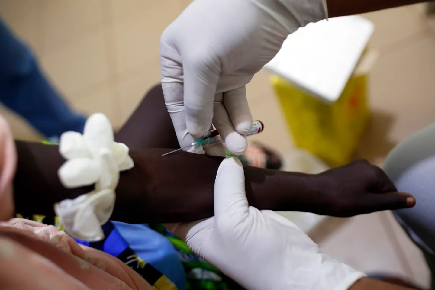 A health worker draws blood at a clinic in Benin. Lenacapavir, a new twice-yearly shot to prevent HIV, could soon be rolled out in similar settings around the world.